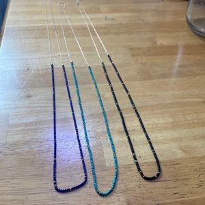 long beaded necklace and gold chain